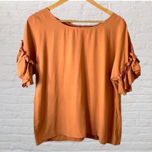 SHEIN short sleeve ruffled blouse boatneck w/ buttons in back.